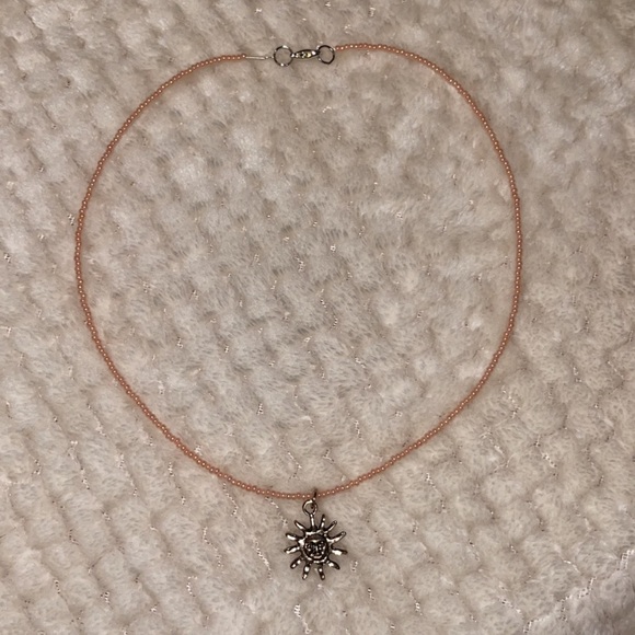 Peach hand- made beaded necklace with sun charm - Picture 1 of 4
